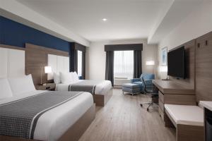 Voodi või voodid majutusasutuse Best Western Plus Gateway to the Falls toas