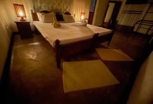 Postel nebo postele na pokoji v ubytování Weeragiri home stay