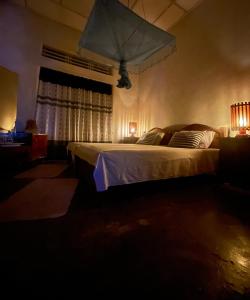 Postel nebo postele na pokoji v ubytování Weeragiri home stay