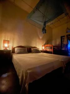 Postel nebo postele na pokoji v ubytování Weeragiri home stay