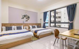 A bed or beds in a room at Daisy's Hsiang Hola