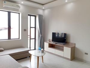 TV a/nebo společenská místnost v ubytování TQ2 Hotel & Apartment