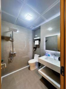 a bathroom with a white toilet and a sink at Sky Hotel & Homestay Ha Giang in Ha Giang +79 photos