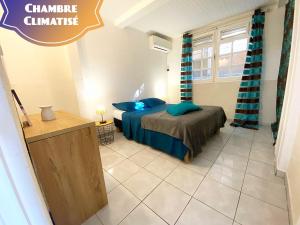 Voodi või voodid majutusasutuse Piscine et Vue Mer - F2 Cosy - Anse à l'Âne, 3-Îlets - Plage 5 min toas