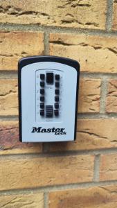 a remote control on the side of a brick wall at Crystalsspace in Braintree +7 photos