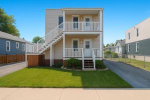 a house with a staircase and a yard at Grande maison moderne 4 chambres - Spa Jaccuzi, Jardin & Parking gratuit - Idéale Familles et groupes in Saint-Jean-sur-Richelieu