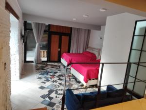 a room with two beds in a room at Suite Reforma in Oaxaca City