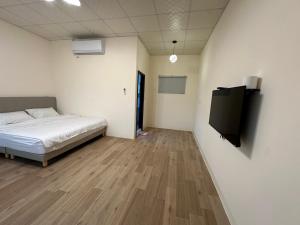 Postel nebo postele na pokoji v ubytování Fu Courtyard Homestay