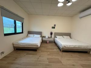 Postel nebo postele na pokoji v ubytování Fu Courtyard Homestay