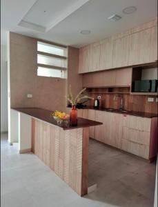 a kitchen with a counter with a bowl of fruit on it at Departamento El Molino in Tarija