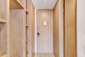 a room with wooden walls and a door at Premium Loft in Bogota in Bogotá