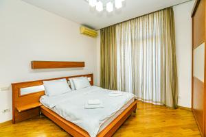 Ένα ή περισσότερα κρεβάτια σε δωμάτιο στο Old Town Apartment by Baku Housing