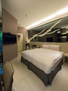 מיטה או מיטות בחדר ב-寓旅宿 Apato Cityhome