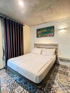 Ένα ή περισσότερα κρεβάτια σε δωμάτιο στο BB House Mini Suite Hotel