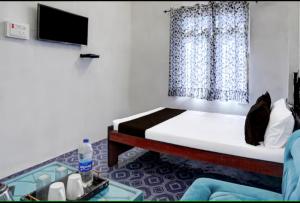 Ένα ή περισσότερα κρεβάτια σε δωμάτιο στο Hotel o crown +2 φωτογραφίες
