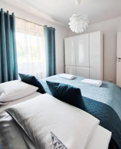 Posteľ alebo postele v izbe v ubytovaní Apartamenty Alcatraz z jacuzzi + 17 fotografií