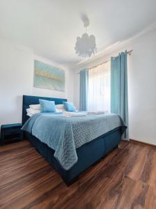 Posteľ alebo postele v izbe v ubytovaní Apartamenty Alcatraz z jacuzzi