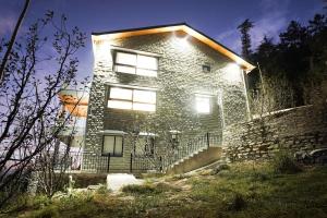 a brick house with lights on top of it at Sunday Premium 5 BHK Villa Mihika, Shimla in Shimla
