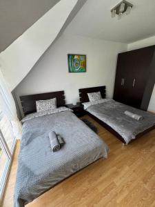 a bedroom with two twin beds in a attic at Apartment Skу in Kavarna +30 photos