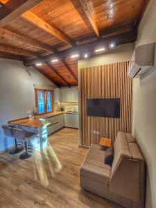 a living room with a couch and a table at Vista Mare in Kámpos +11 photos