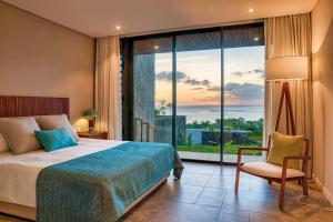 Ένα ή περισσότερα κρεβάτια σε δωμάτιο στο Domaine d'Anbalaba - Baie du Cap - Ile Maurice