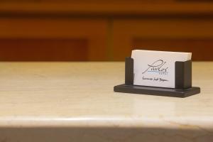 a small white box sitting on top of a table at Pavlos Hotel in Kos Town