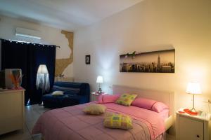 Postel nebo postele na pokoji v ubytování Suites Florence