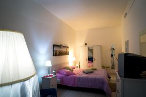 Postel nebo postele na pokoji v ubytování Suites Florence