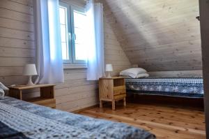 Postel nebo postele na pokoji v ubytování aleChata - 3 domki
