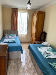 Letto o letti in una camera di Ana House