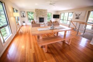 a living room with a table and a couch at Alpine Nest in Bright
