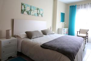 Posteľ alebo postele v izbe v ubytovaní Habitaciones Castelao