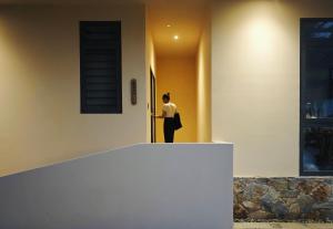 a person standing at the door of a house at Field Villa Hoàng Diệu in Ấp Long Kiên I +49 photos