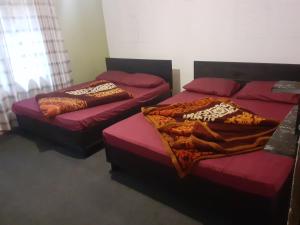 Ένα ή περισσότερα κρεβάτια σε δωμάτιο στο Moon Ridge Holiday Home