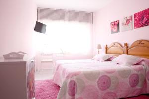 Posteľ alebo postele v izbe v ubytovaní Habitaciones Castelao