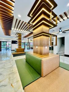 a lobby with a fountain in the middle of a building at Momento Phu Quoc Hotel in Phu Quoc