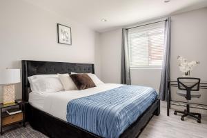 a bedroom with a large bed and a window at charming home in LA prime location in Los Angeles