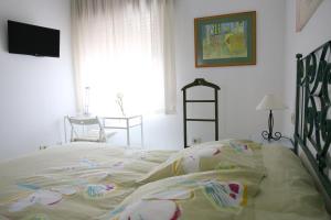 Posteľ alebo postele v izbe v ubytovaní Habitaciones Castelao