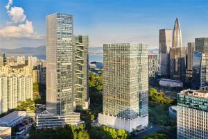 an aerial view of a city with tall buildings at Doubletree By Hilton Shenzhen Bay in Shenzhen