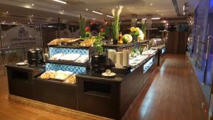 a buffet line with many different types of food at Qasr Al Sahab in Khamis Mushayt