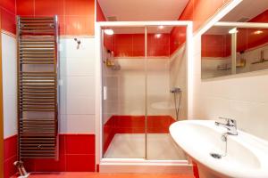 a bathroom with a glass shower and a sink at Casa Venerable Carabantes in Soria +52 photos