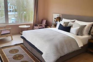 a bedroom with a large bed and a window at Hotel Dekiling by Eastlynn Collections in Leh +39 photos