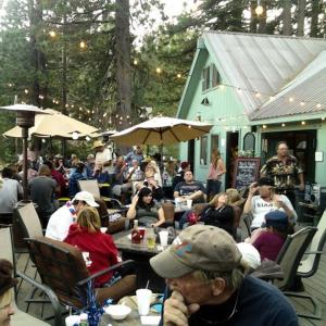 a group of people sitting at an outdoor table at Huntington Lake Resort and Marina in Lakeshore