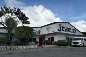 a white building with a van parked in front of it at Jewelry Resort and Villas Tagaytay in Silang +137 photos