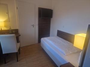 Postel nebo postele na pokoji v ubytování Halber Mond