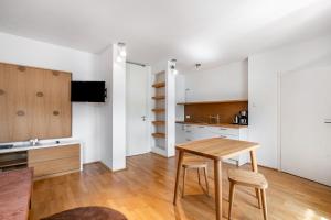 a kitchen and dining room with a table and chairs at Ferienwohnung Fenzl in Johanngeorgenstadt