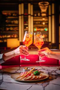 a group of people holding up wine glasses at Hyatt Regency Tokyo in Tokyo