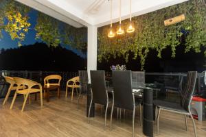 a dining room with a table and chairs at Kandy Luxe Villa in Kandy