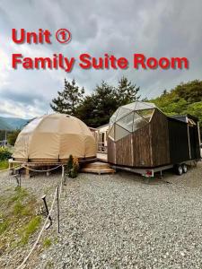 a family suite room and a tent and a trailer at Fuji Dome Glamping in Fujikawaguchiko