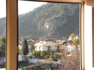 a view of a mountain from a window at Ada Apart Hotel in Dalyan